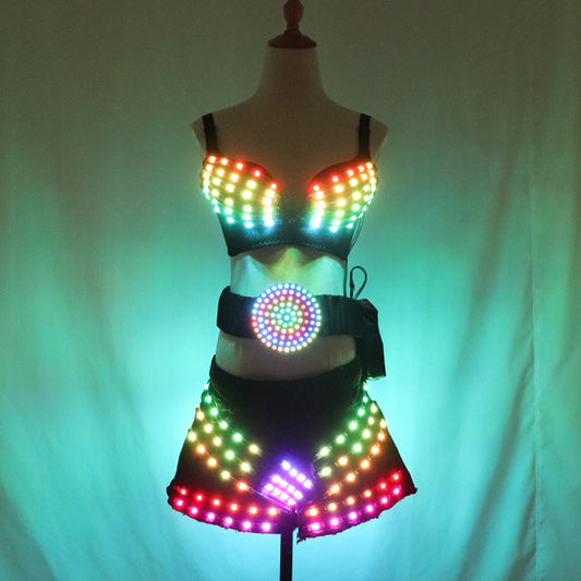 La fille sexy de jupe de lumière lumineuse menée polychrome a mené des costumes lumineux